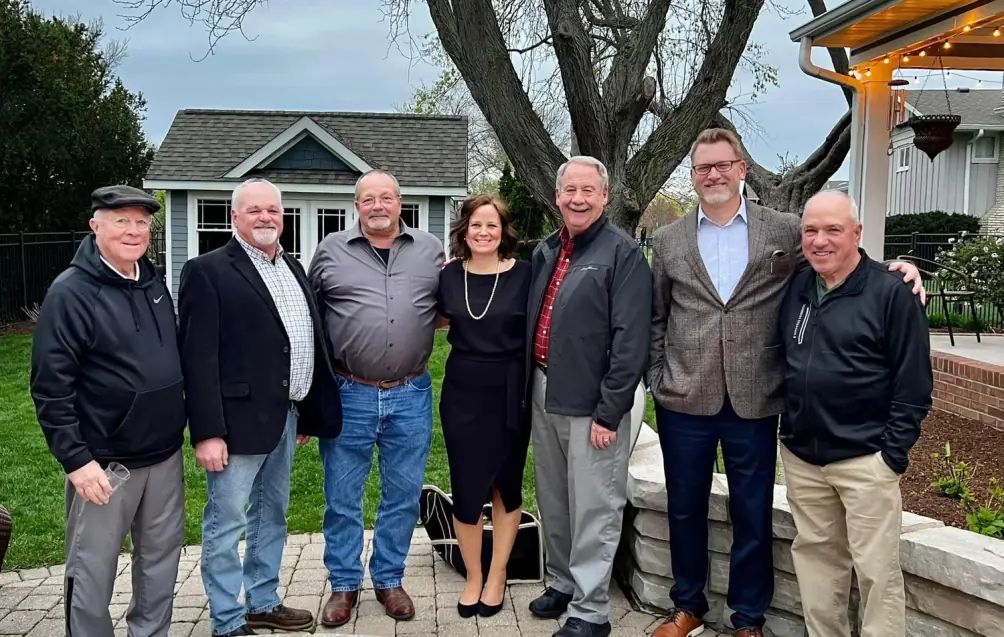Dr. Bill Hauter with county leaders at a backyard gathering